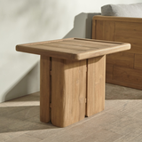 Outdoor wooden end table on a wooden floor