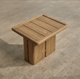 Outdoor wooden end table with slatted top on a wooden floor