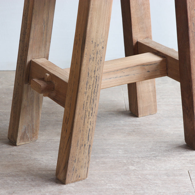 Leg detail of Vanity Stool, showing the construction and texture of the reclaimed teak wood.