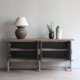 Reclaimed pine wood sideboard with decorative items in a room setting