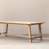 Outdoor wooden dining table with live edge planks on top