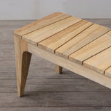 Wooden bench with slatted top on a wooden floor.
