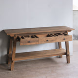 Reclaimed teak wood cabinet with drawers against a white wall
