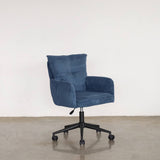Blue office chair with wheels on a light stone floor and white wall background