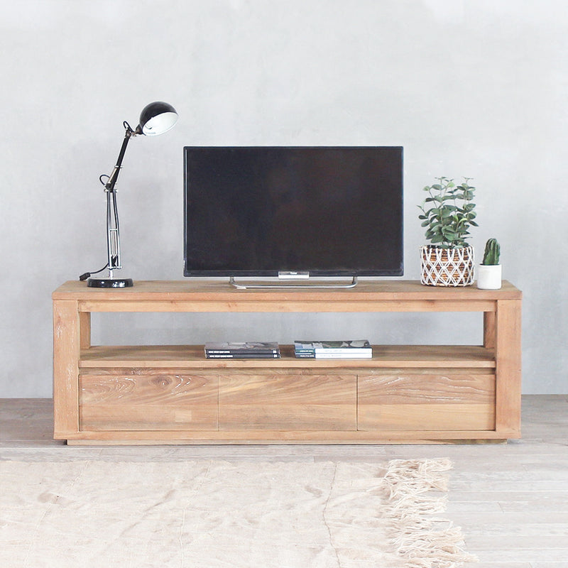 Horizonte TV Cabinet with a TV, lamp, and decorative plants on top of it.