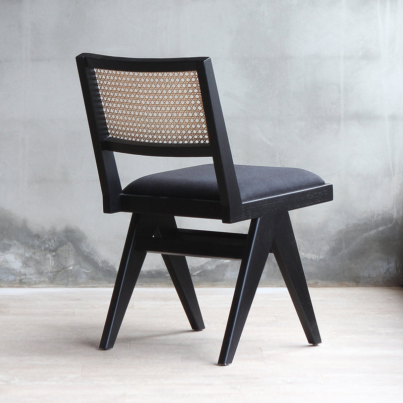 Back view of Torino Rattan Chair with black wood frame and fabric.
