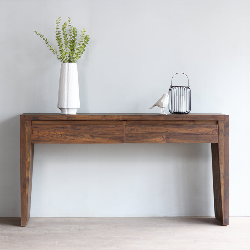 KAMA console table with decorations on top of it