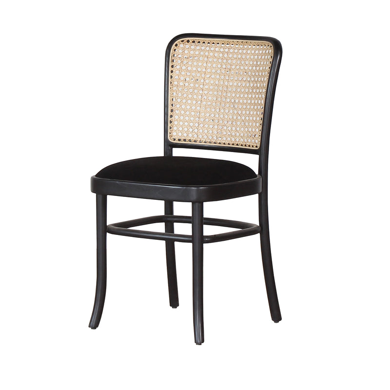 Moi Rattan Dining Chair with black velvet fabric.