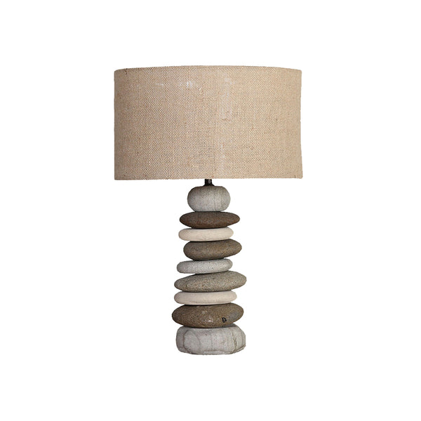 Table lamp with stand made from pebbles and lamp shade made from jute.