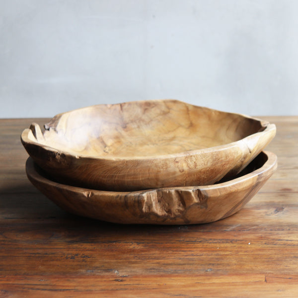 Two stacked Round Wooden Bowls. Made from teak wood.